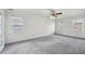 Bedroom featuring neutral colored walls and carpeting with windows at 6317 Southland Forest Dr, Stone Mountain, GA 30087