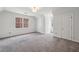Spacious bedroom with multiple closets and large windows for ample natural light at 6317 Southland Forest Dr, Stone Mountain, GA 30087