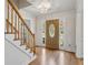Bright foyer with hardwood floors, a staircase, and decorative front door with sidelights at 6317 Southland Forest Dr, Stone Mountain, GA 30087