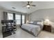 Bedroom with ceiling fan, a computer desk, and great natural light at 3826 Dandridge Way, Duluth, GA 30096
