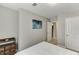 Bedroom with neutral walls and flooring adjacent to a linen closet at 3826 Dandridge Way, Duluth, GA 30096