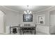 Elegant dining room with modern lighting and a view into the kitchen at 3826 Dandridge Way, Duluth, GA 30096