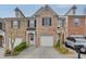 Charming brick townhome with a one-car garage and manicured landscaping at 3826 Dandridge Way, Duluth, GA 30096