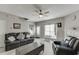 A living room with a black leather sofa, accent chair, and fireplace at 3826 Dandridge Way, Duluth, GA 30096
