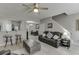 Open-concept living room with adjacent dining area and breakfast bar seating at 3826 Dandridge Way, Duluth, GA 30096
