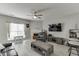 Spacious living room with ceiling fan, a fireplace, and great natural light at 3826 Dandridge Way, Duluth, GA 30096