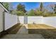 Fenced backyard showcasing the lawn and concrete patio area at 4322 Idlewood Ln, Tucker, GA 30084