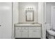 White bathroom vanity with plenty of cabinets and granite countertop at 4322 Idlewood Ln, Tucker, GA 30084