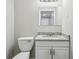Well-lit bathroom with sleek granite counters and modern fixtures creates a comfortable and stylish space at 4322 Idlewood Ln, Tucker, GA 30084