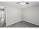 Carpeted bedroom featuring ceiling fan and an adjoining doorway at 4322 Idlewood Ln, Tucker, GA 30084