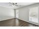 Bedroom with new light fixture and two windows providing natural light and new flooring at 4322 Idlewood Ln, Tucker, GA 30084