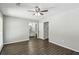 Bedroom featuring a ceiling fan and modern flooring, leading to the bathroom and closet at 4322 Idlewood Ln, Tucker, GA 30084