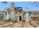 Inviting townhome showcases a classic facade, complemented by mature landscaping and a well-maintained walkway at 4322 Idlewood Ln, Tucker, GA 30084