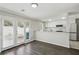 Open-concept area with access to a modern kitchen featuring stainless steel appliances and sleek countertops at 4322 Idlewood Ln, Tucker, GA 30084