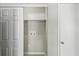 Utility area highlighting the washer and dryer hookups and closet storage space at 4322 Idlewood Ln, Tucker, GA 30084