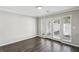Bright living room with hardwood floors featuring sliding doors perfect for indoor-outdoor living and entertaining at 4322 Idlewood Ln, Tucker, GA 30084