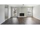 Sun-drenched living room with a traditional fireplace providing a comforting focal point for gatherings at 4322 Idlewood Ln, Tucker, GA 30084