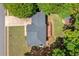 Aerial view of the home's roof, deck, driveway, and surrounding greenery at 100 Oakwind Pkwy, Canton, GA 30114