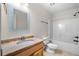 Bright bathroom with a granite vanity and a shower and tub combination at 100 Oakwind Pkwy, Canton, GA 30114