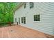 Back of home featuring a light-green exterior and a spacious wooden deck perfect for outdoor relaxation at 100 Oakwind Pkwy, Canton, GA 30114