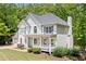 Charming two-story home with a three-car garage, landscaped front yard, and welcoming front porch at 100 Oakwind Pkwy, Canton, GA 30114