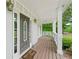 Inviting front porch with a decorative door, sidelights, and a welcome mat at 100 Oakwind Pkwy, Canton, GA 30114