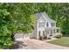 Charming two-story home with a manicured lawn, a two-car garage, and lovely curb appeal at 100 Oakwind Pkwy, Canton, GA 30114