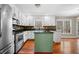Kitchen island featuring granite countertops and white cabinets at 100 Oakwind Pkwy, Canton, GA 30114