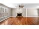 Bright living room features a stone fireplace and large windows with scenic views at 100 Oakwind Pkwy, Canton, GA 30114