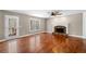 Comfortable living room with fireplace, hardwood floors, and natural light at 100 Oakwind Pkwy, Canton, GA 30114
