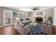 Cozy living room with hardwood floors, fireplace, and plenty of natural light at 100 Oakwind Pkwy, Canton, GA 30114