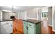 Open floor plan showing kitchen island, fireplace and dining area at 100 Oakwind Pkwy, Canton, GA 30114