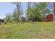 Spacious grassy backyard with mature trees at 3969 Potomac Nw Dr, Kennesaw, GA 30144