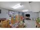 The basement features carpeted floors, drop lighting, and ample space for storage and activities at 3969 Potomac Nw Dr, Kennesaw, GA 30144