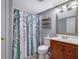 This bathroom features tile floors, a wooden vanity, and a shower/tub at 3969 Potomac Nw Dr, Kennesaw, GA 30144