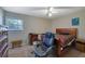 This bedroom has a ceiling fan, neutral walls, and an office space for comfort and convenience at 3969 Potomac Nw Dr, Kennesaw, GA 30144