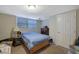 Cozy bedroom with natural light, carpeted floors, and a closet that can provide a comfortable space at 3969 Potomac Nw Dr, Kennesaw, GA 30144