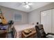 Neutral bedroom with ceiling fan, closet, and window for natural light at 3969 Potomac Nw Dr, Kennesaw, GA 30144