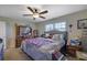 Cozy bedroom with a comfortable bed, ceiling fan, and dresser that offers space to relax and unwind at 3969 Potomac Nw Dr, Kennesaw, GA 30144