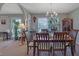 Comfortable dining room area featuring wood table, chandelier lighting, and view into the living room at 3969 Potomac Nw Dr, Kennesaw, GA 30144