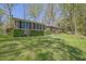 Well-maintained brick home with manicured hedges, a spacious front yard, and mature trees at 3969 Potomac Nw Dr, Kennesaw, GA 30144