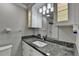 Bathroom vanity with granite counters, mirrored cabinets, and vanity lights at 5155 Rosestone Nw Dr, Lilburn, GA 30047