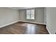 Sunny bedroom with hardwood floors, natural light, and neutral paint ready for furnishings at 5155 Rosestone Nw Dr, Lilburn, GA 30047