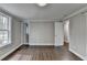 Bright bedroom with hardwood floors, and updated neutral paint ready for furnishings at 5155 Rosestone Nw Dr, Lilburn, GA 30047