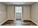 Bedroom with hardwood floors, fresh paint, two closets and a window at 5155 Rosestone Nw Dr, Lilburn, GA 30047