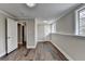 Bright bedroom with hardwood floors, and updated neutral paint ready for furnishings at 5155 Rosestone Nw Dr, Lilburn, GA 30047