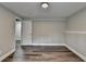 Bright bedroom with hardwood floors, and updated neutral paint ready for furnishings at 5155 Rosestone Nw Dr, Lilburn, GA 30047