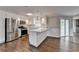 Well-equipped kitchen boasting stainless appliances, white cabinets, and countertop seating at 5155 Rosestone Nw Dr, Lilburn, GA 30047