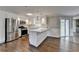 Modern kitchen features white cabinets, stainless steel appliances, and a stylish island at 5155 Rosestone Nw Dr, Lilburn, GA 30047