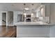Well-equipped kitchen boasting stainless appliances, white cabinets, and countertop seating at 5155 Rosestone Nw Dr, Lilburn, GA 30047